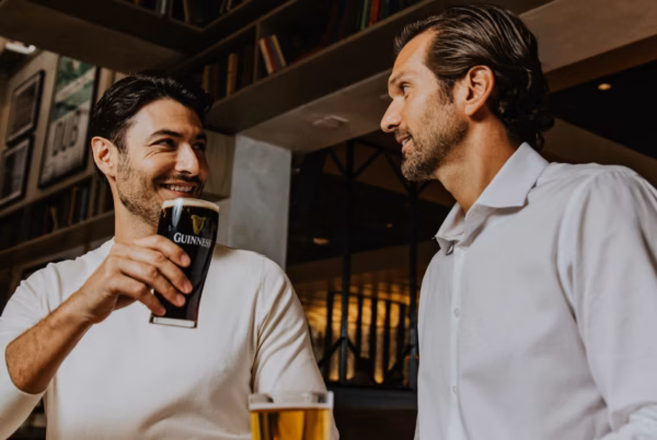 Two men talking over a pint