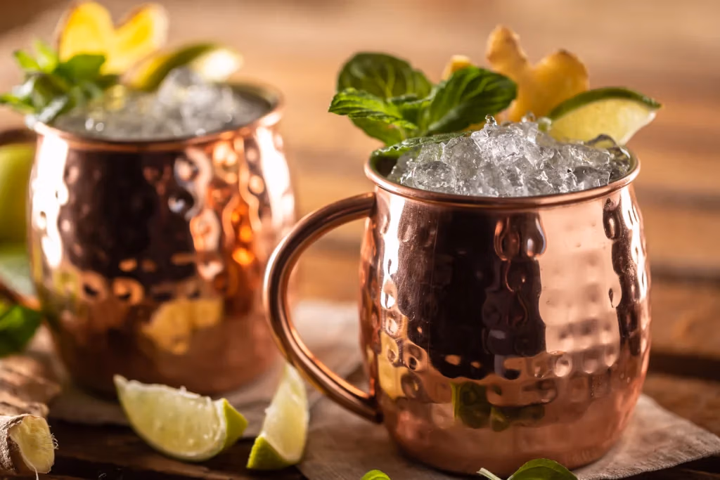 Irish mule highball cocktail long vodka drink with fresh lime ginger beer mint